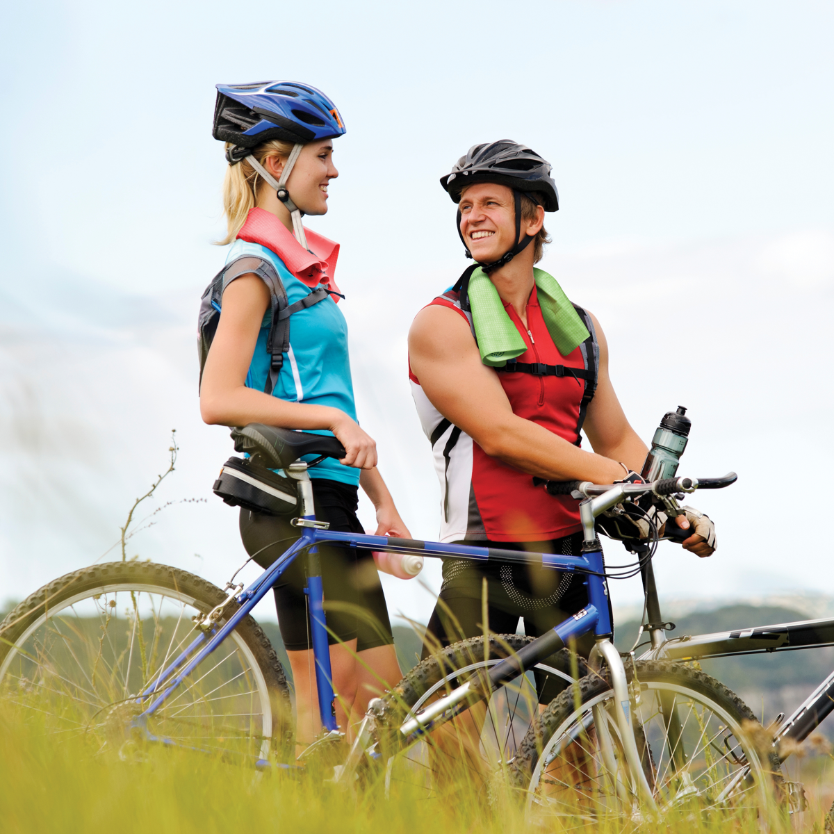 Cycling-Social man and woman standing by bikes