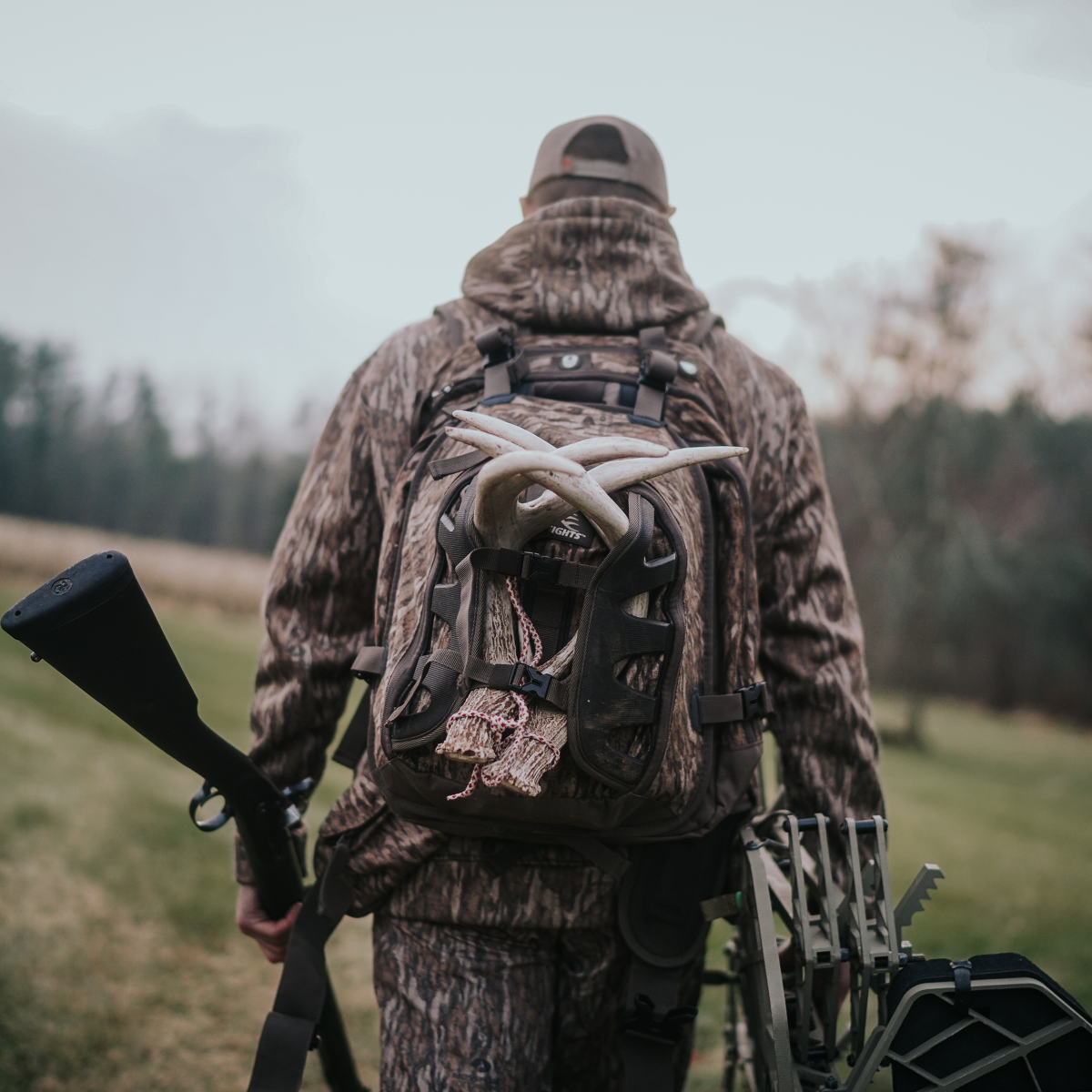 Firearms-Hunting_Creative guy wearing backpack hunting