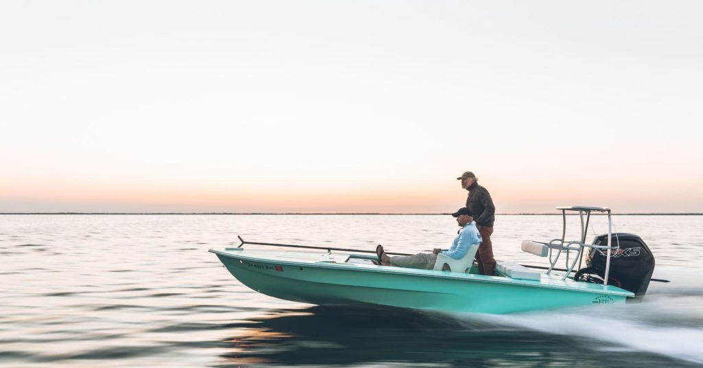 men riding in boat