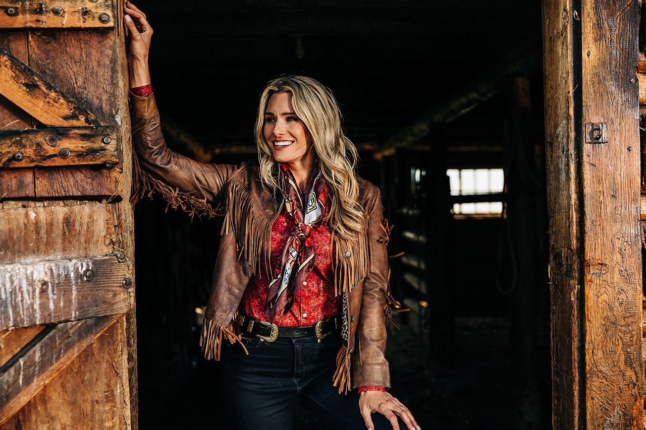 Lady wearing jacket in barn